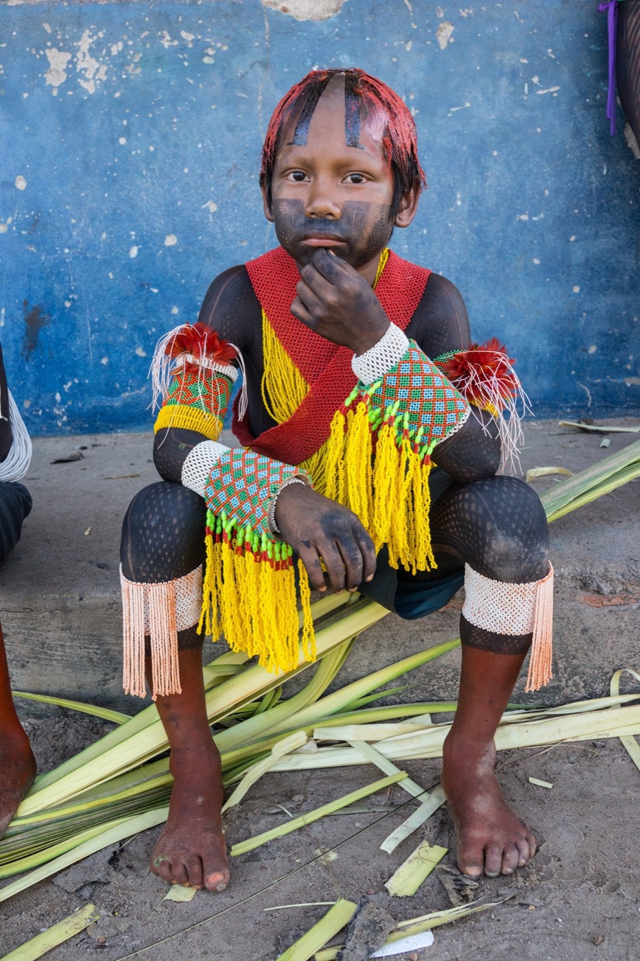 Still from LAST OF THEM: young Xikrin boy in ceremonial beads, Amazon